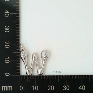 Detailed view of silver letter W pendant with zircon stones showing 20mm size and 3.55g weight