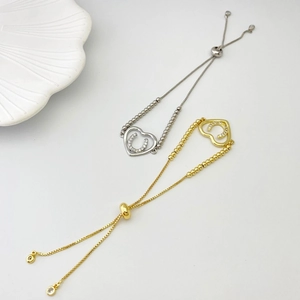 Detail of adjustable heart and horseshoe chain bracelet with sparkling cubic zirconia stones