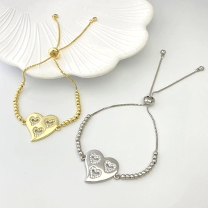 Adjustable heart charm bracelets in gold and silver finish with crystal detailing