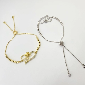 Detail of adjustable heart bracelet with rose flower and sparkling crystals decoration