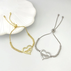 Detail of adjustable heart bracelets with elephant relief and sparkling zircon inlay