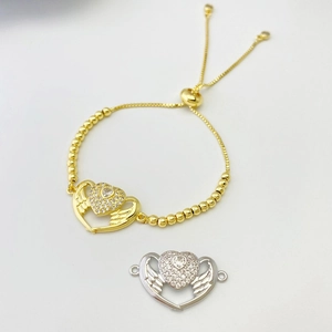 Adjustable gold heart bracelet with angel wings and micro-pave cubic zirconia details