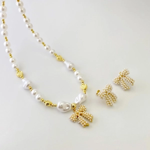 Fashion acrylic pearl necklace and shell bow earring set for beach styling