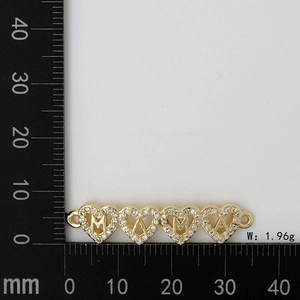 Detail of MOM letter heart connector charm with white crystals and weight measurement