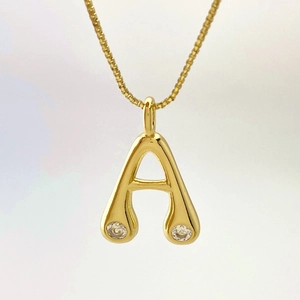 Minimalist gold teardrop necklace with letter A pendant and sparkling zircon accents