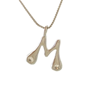 Minimalist silver letter M pendant necklace with cubic zirconia on a fine box chain