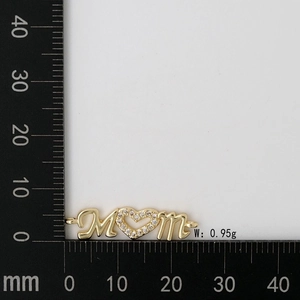 Detail view of gold Mom pendant with heart stone and ruler showing size and weight