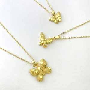 Elegant 18K gold plated copper butterfly necklaces with unique textured finish on white background