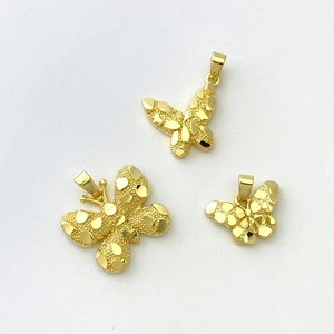 Three-piece gold-plated butterfly pendants with unique hammered texture in varying sizes
