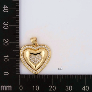 Detailed view of 24x22mm gold heart pendant with cubic zirconia and 3g weight scale