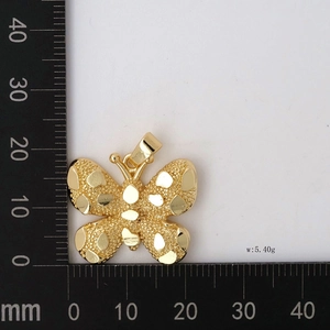 Detail of 18K gold-plated butterfly pendant with measurements and 5.40g weight on scale