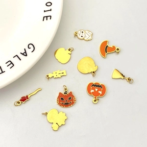 Halloween stainless steel pendant set featuring pumpkin, black cat, and witch hat charms