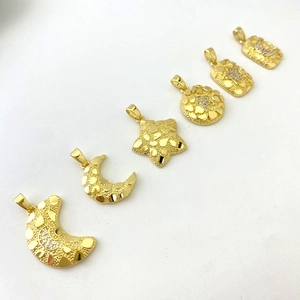 Detail of 18K gold plated moon and star pendants with micro-pave cubic zirconia