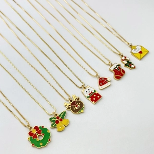 Detailed close-up of colorful enamel Christmas necklaces featuring reindeer and bells