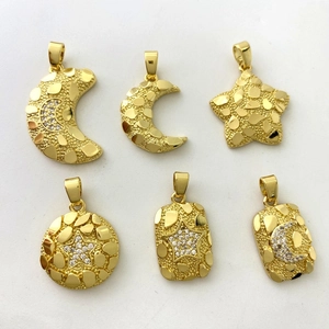 Detailed close-up of six gold nugget texture pendants with star and moon zircon accents