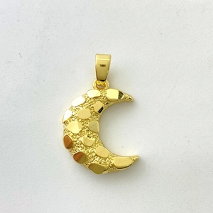 Detail of moon pendant with gold texture and cubic zirconia on 18K plated surface