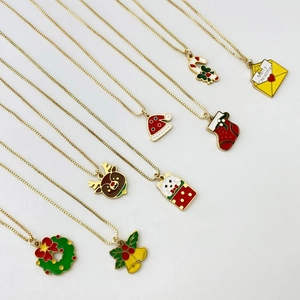 Christmas necklace collection with festive enamel pendants on gold stainless steel chains
