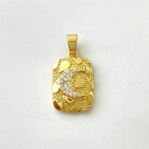 Detail of a rectangular gold-plated pendant featuring a micro-set zircon moon and texture