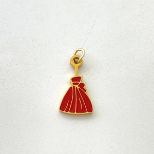 Detailed view of red enamel pumpkin charm in gold metal frame for DIY jewelry making