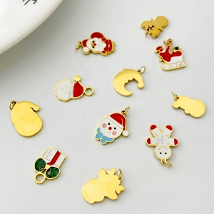 Detailed view of colorful Christmas themed enamel charms with gold metal plating for DIY jewelry