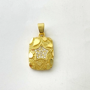 Macro detail of 18K gold rectangular nugget pendant with zircon star and heart accents
