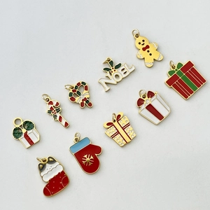 Set of 10 Christmas charms featuring Santa and Noel motifs with gold metal plating
