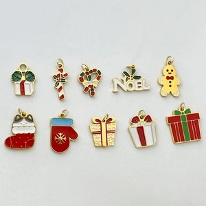 Set of 10 festive Christmas enamel charms including Santa, gifts, and candy canes for DIY