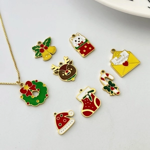 Set of eight colorful Christmas enamel charms featuring deer, wreaths, and festive icons