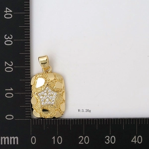 Detailed macro view showing the star pendant dimensions with a ruler for size reference