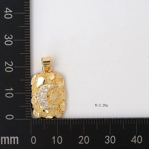 Detailed scale measurement of gold rectangle pendant with crescent moon and zircon inlay