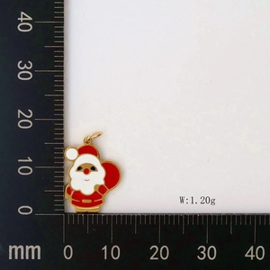 Detailed macro view of a 15mm Santa Claus pendant charm showing size on scale
