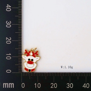Detail view of red and gold Christmas reindeer pendant with measurement scale
