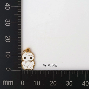 Detail of a cute mummy pendant in gold and white enamel measuring 15mm by 10mm