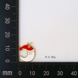 Detailed view of Santa and moon enamel pendant with size scale and 0.90g weight