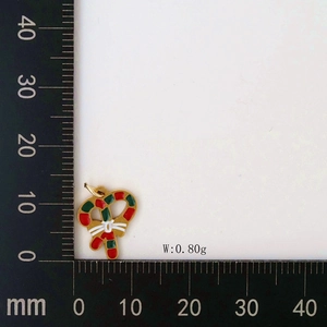 Detailed view of Christmas candy cane pendant with bow and weight measurement 0.80g