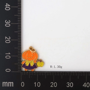 Detailed view of enamel pumpkin pendant with size ruler and 1.30g weight measurement