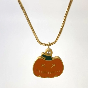 Golden box chain necklace featuring a creative orange pumpkin pendant for Halloween outfits