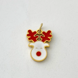 Detail of Christmas reindeer pendant with red enamel antlers and gold plated metal finish
