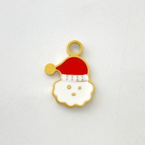 Detail view of Santa Claus enamel charm with golden edges and a metal hanging ring