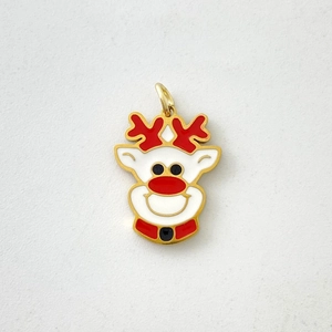 Close-up of a Christmas reindeer charm in gold finish with red and white enamel detail