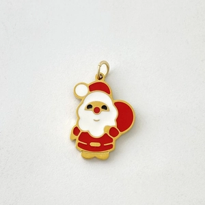 Close-up of a gold-plated Santa Claus pendant with red and white enamel for necklaces
