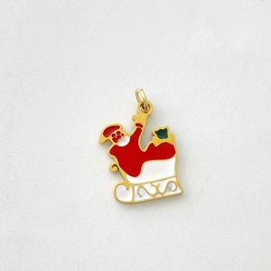 Detail of Christmas Santa on sleigh pendant with red and green enamel for DIY jewelry
