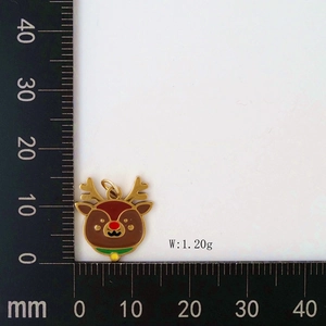 Detail view of colorful reindeer pendant with oil drip process and scale measurement
