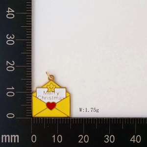 Detail of Christmas envelope pendant with Merry Christmas text and size measurement scale