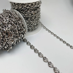 Detail of silver heart and pig-nose style alloy chains for DIY jewelry making