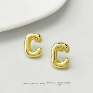 Macro view of gold letter C stud earring with balloon-style texture and dimensions