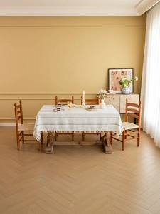 Detail of Nordic cream tablecloth featuring blue geometric patterns and fringe tassels