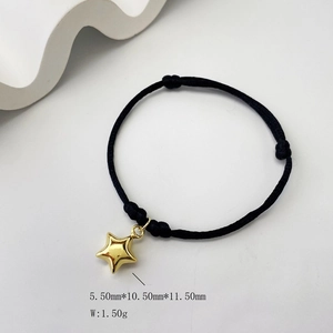 Close-up of black braided cord bracelet with 3D gold star pendant and dimensions