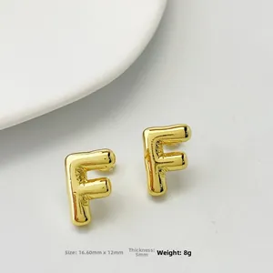 Detailed size view of gold-finished 3D balloon Letter F stud earrings for women
