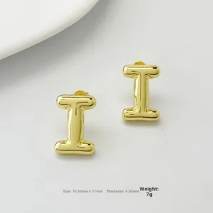 Detailed view of polished golden letter I stud earrings with size measurements